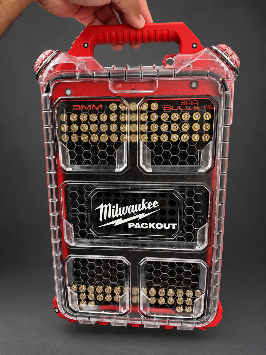 Milwaukee PACKOUT with BlackWolf insert held by its handle; retouched product photo.