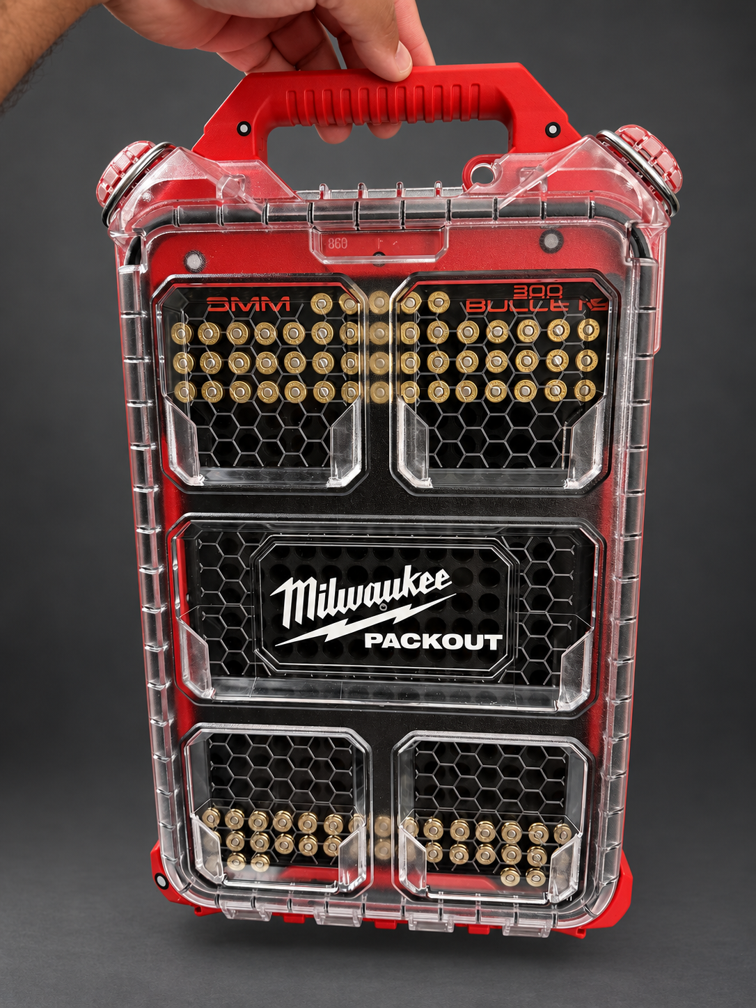 Milwaukee PACKOUT with BlackWolf insert held by its handle; retouched product photo.